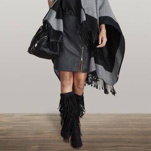 Black boots with fringes